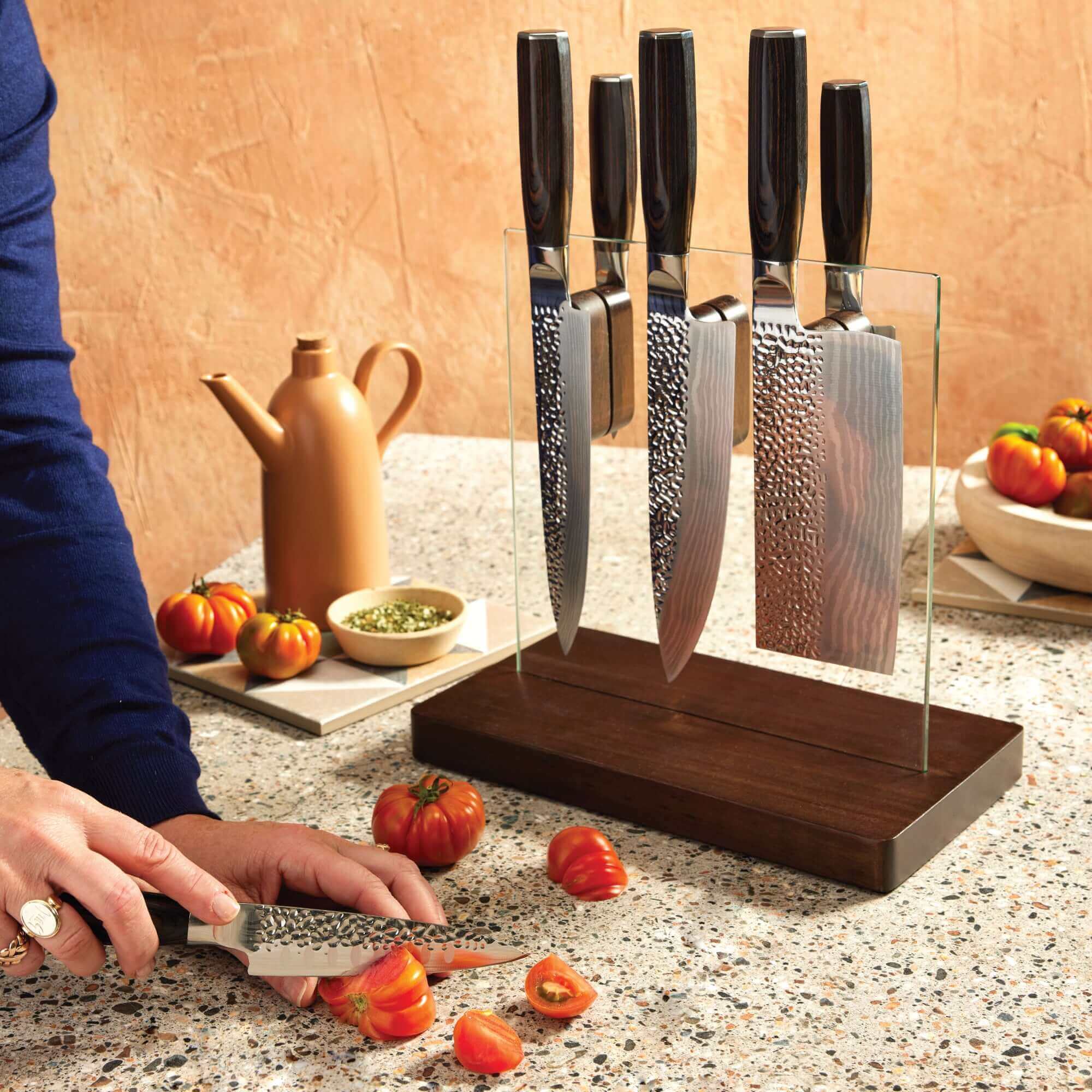 The Cuisine::pro® Damashiro® EMPEROR Hikari Knife Block 7 Piece with Ash wood handles in a tempered glass block, knives for chopping tomatoes