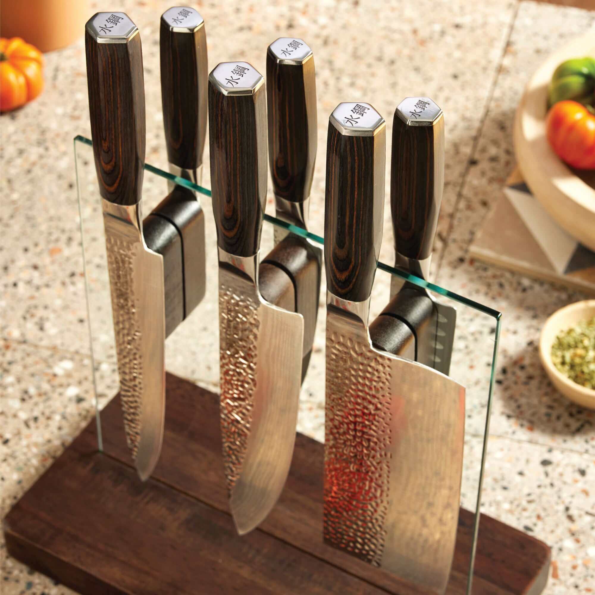 Cuisine::pro® Damashiro® EMPEROR Hikari 7 Piece Knife Block with Ash wood handles in tempered glass block on kitchen counter