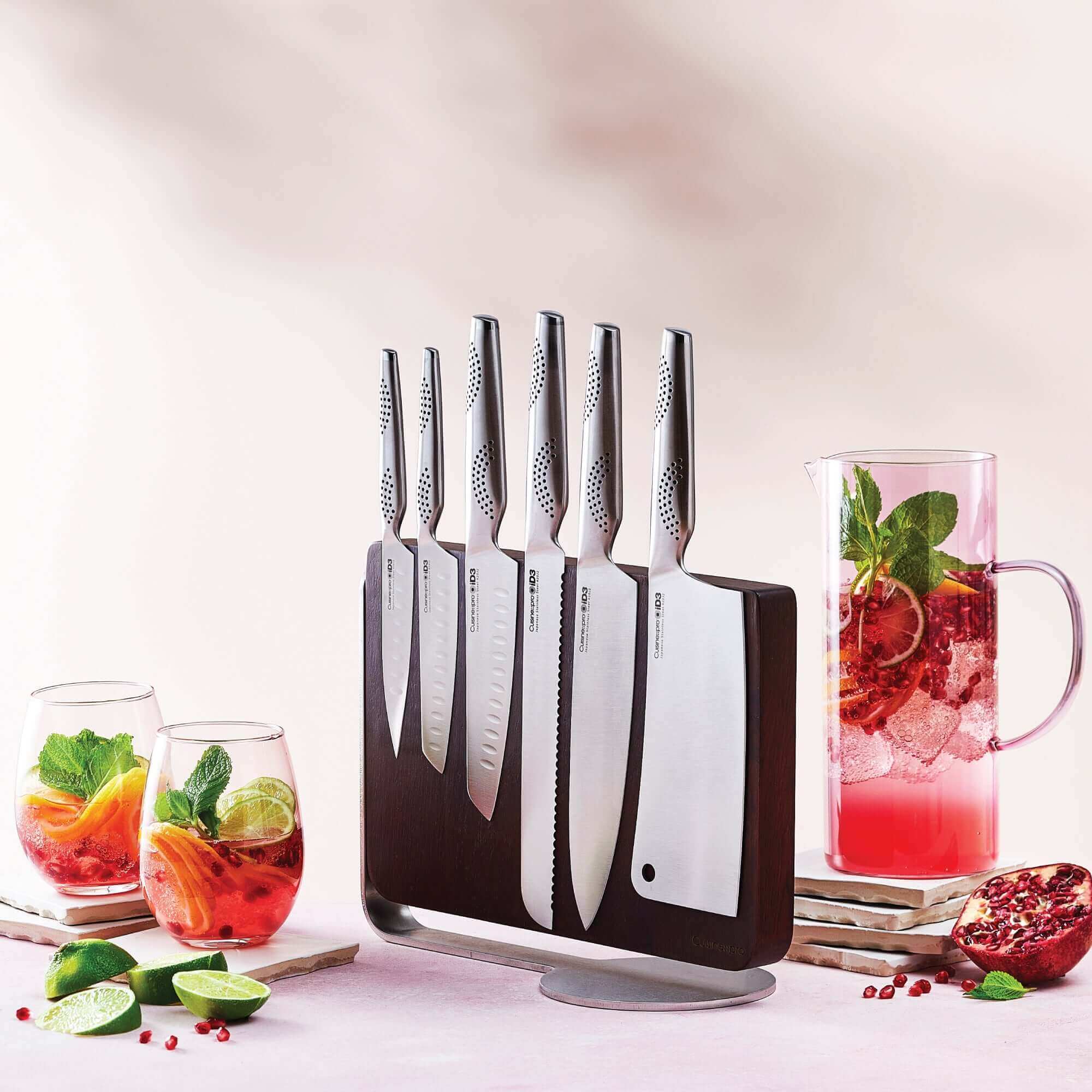 Cuisine::pro® iD3® Nakano 7 Piece Knife Block on countertop with drinks and fruits