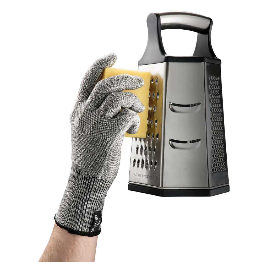 Cuisine::pro® iD3® Protecta Glove used for safely grating cheese with a metal box grater, offering cut resistance and superior dexterity.