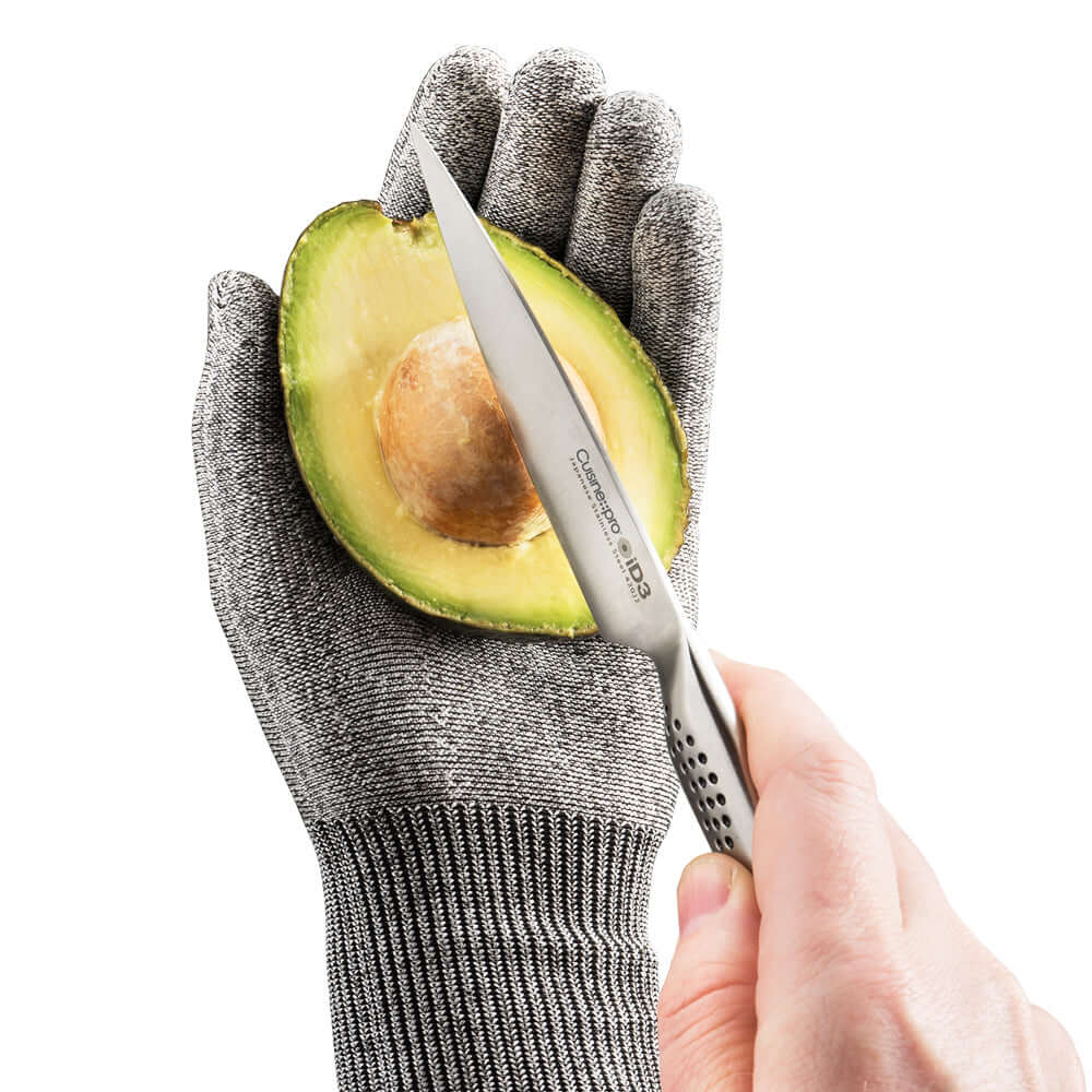 Cutting avocado with Cuisine::pro® iD3® Resistant Glove for optimal cut resistance and dexterity