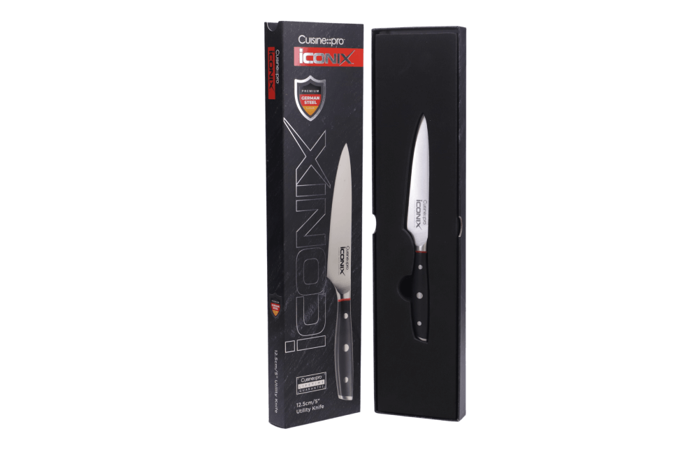 Cuisine::pro® iconiX® Utility Knife 12.5cm 5in in packaging, showcasing its curved blade edge and premium German stainless craftsmanship.